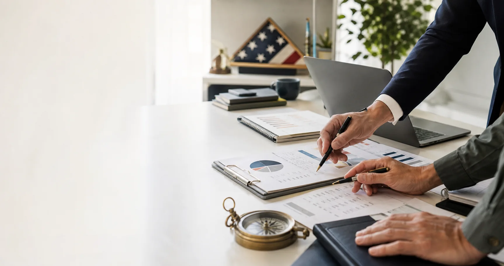Strategic marketing planning workspace with charts, compass, and veteran-owned business cues